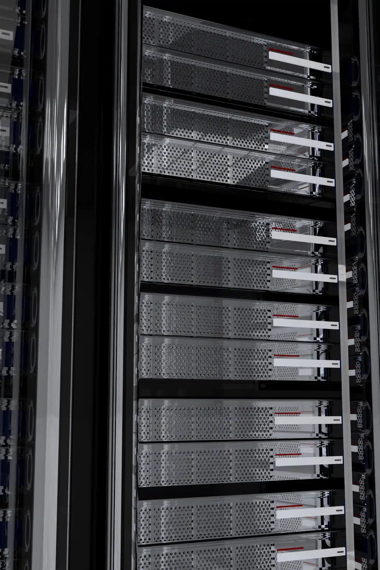 A close-up of cabinets with server racks. Multiple vertically positioned metal server boxes with cables and cooling vents???infrastructure for hosting or enterprise computing???are visible within a data centre.